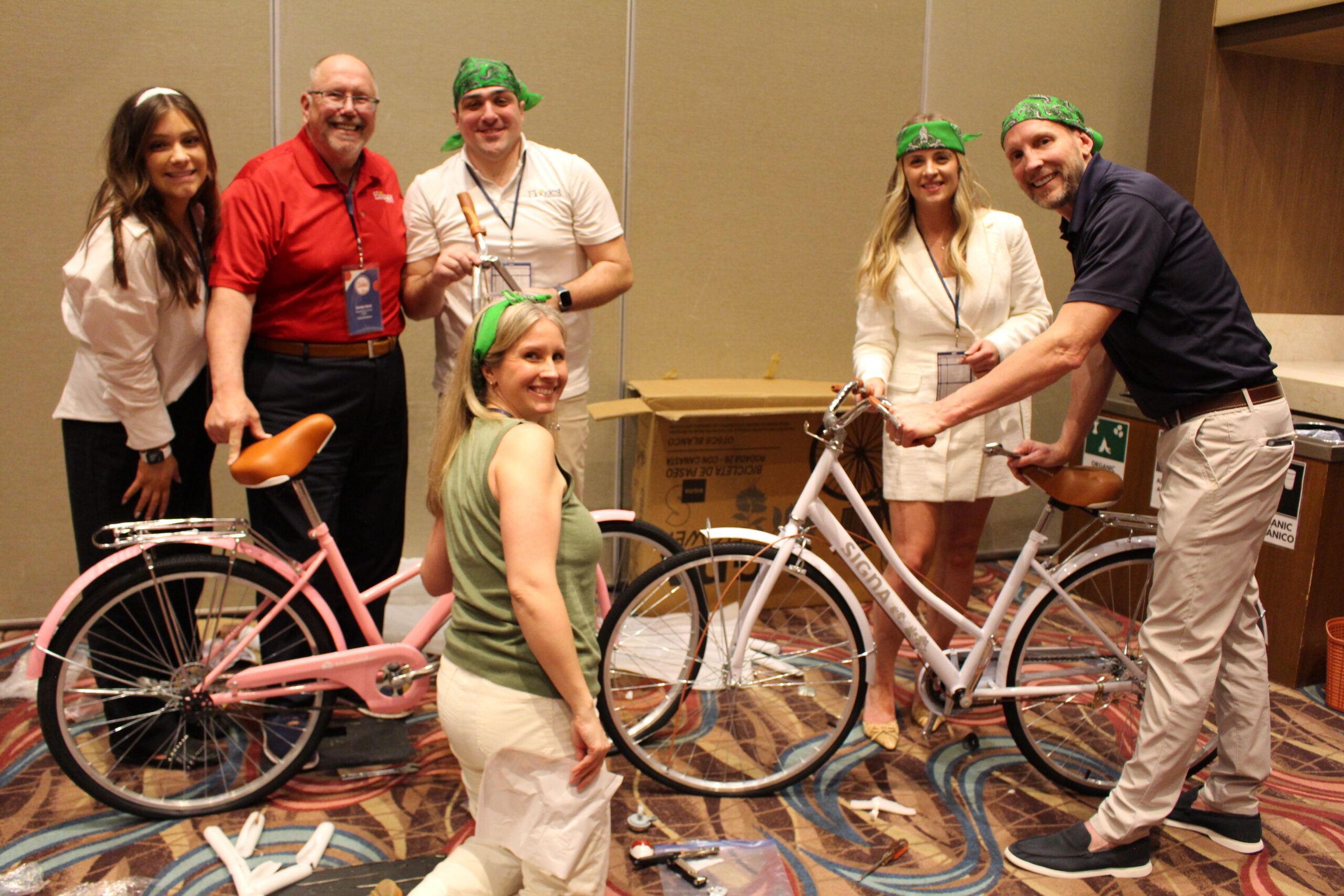 Image of Eloquest staff building bikes for a charity event