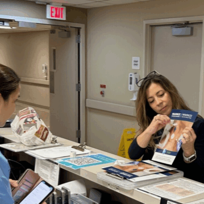 Territory Manager in Hospital, providing education at nurses station.
