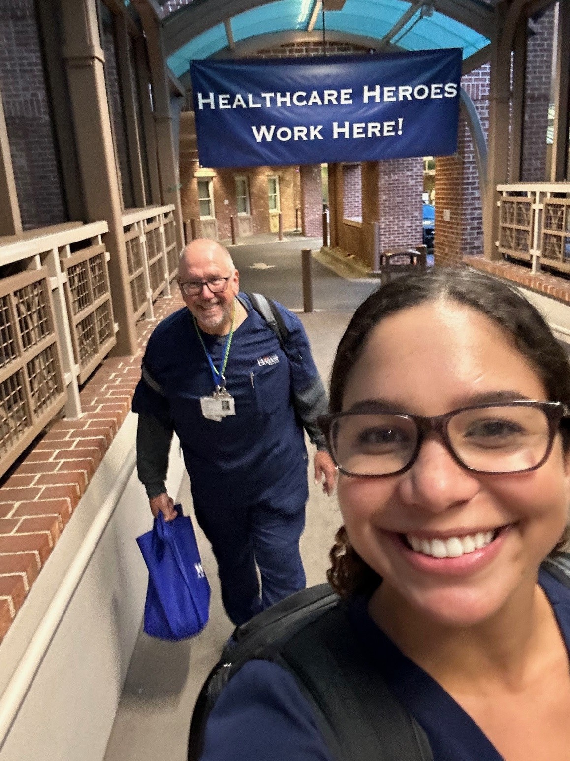 Sales team in front of a Healthcare Heroes Work Here banner
